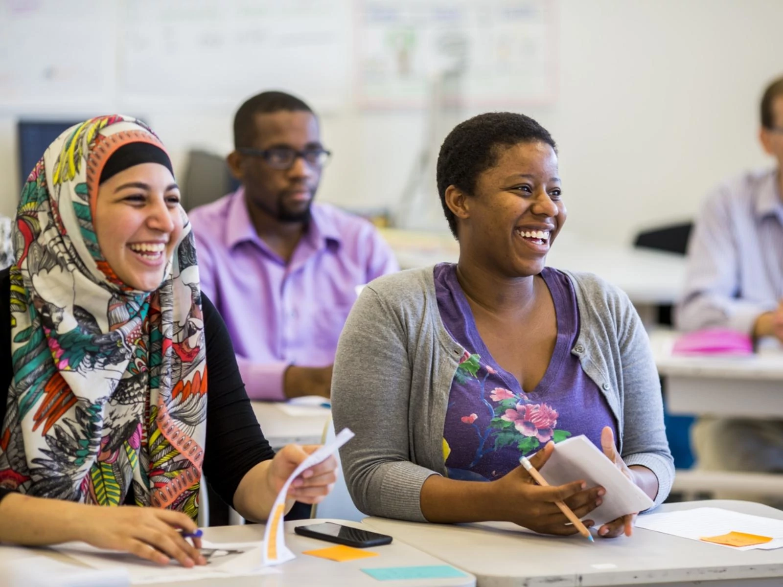 Smiling teachers attend a presentation
