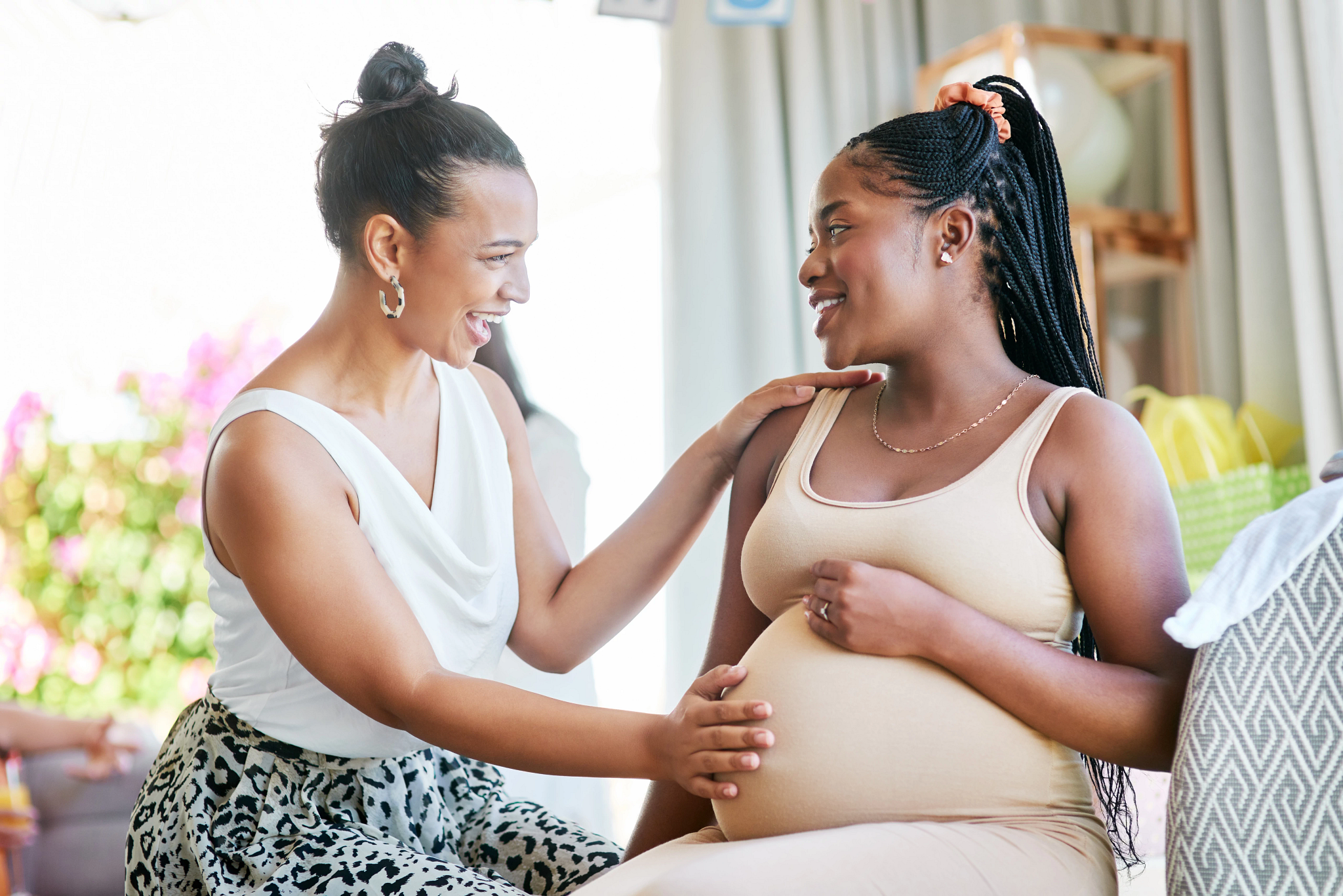 Pregnant woman with supportive friend