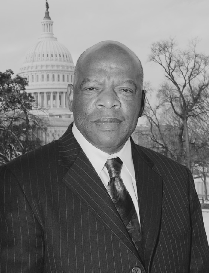 A black and white portrait of former U.S. Congressman John Lewis against a backdrop of the capitol building.